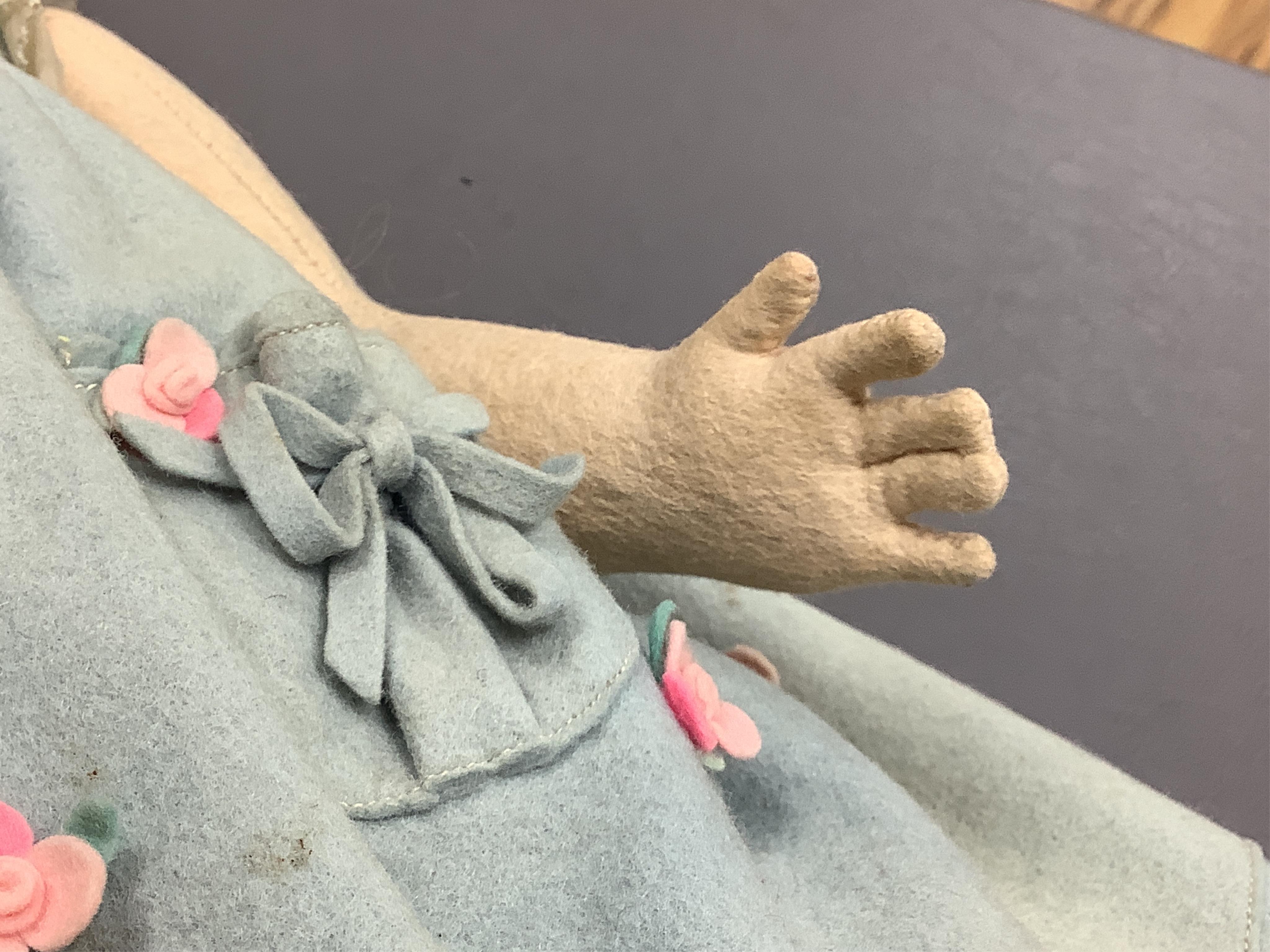 A wool felt Lenci doll with painted features to the face, 42cm long